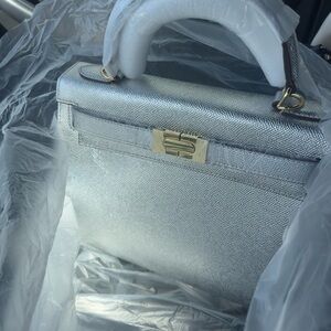 Silver Satchel with Structured Design and Gold-Tone Hardware